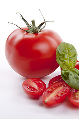 Image showing fresh red tomatoes with balsamic and oilve oil isolated