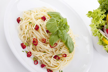 Image showing fresh pasta with chilli and basil isolated