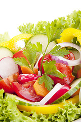 Image showing fresh tasty mixed salad with different vegetables isolated