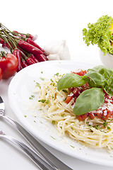 Image showing tatsty fresh spaghetti with tomato sauce and parmesan isolated