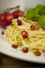 Image showing fresh pasta with basil and red chilli on table