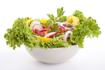 Image showing fresh tasty mixed salad with different vegetables isolated