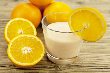 Image showing fresh tropical orange yoghurt shake dessert on table