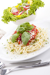 Image showing tatsty fresh spaghetti with tomato sauce and parmesan isolated