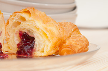 Image showing croissant French brioche filled with berries jam