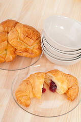 Image showing croissant French brioche filled with berries jam