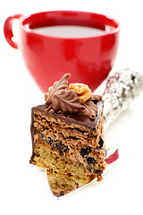 Image showing Piece of chocolate cake and a cup of tea.