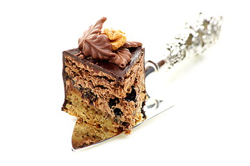 Image showing Piece of chocolate cake with prunes. 