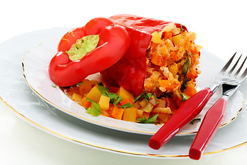 Image showing Peppers stuffed vegetables and turkey on a white plate.