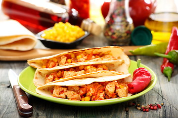 Image showing Mexican wheat tortillas with spicy stuffing.