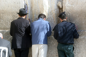 Image showing Jewish men pray at the western wall