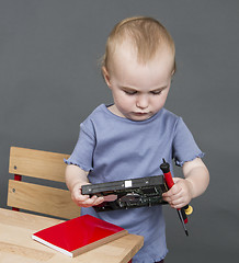 Image showing child with hard drive and tools