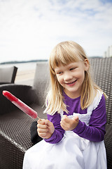 Image showing Girl with popsicle