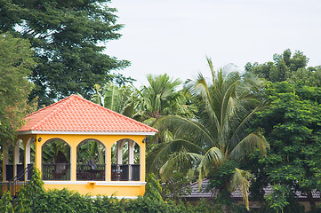 Image showing Yellow pavilion in tropical surroundings