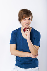 Image showing Young man with a apple