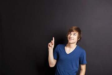 Image showing Young man over a chalk board