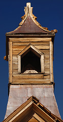 Image showing Old wooden church steeple against a deep blue sky