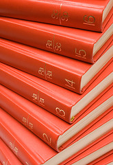 Image showing Stacked Red Books