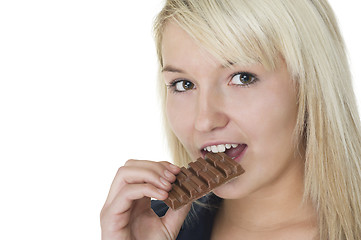 Image showing Attractive woman eating chocolate