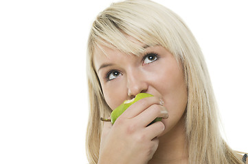 Image showing Woman munching on a green apple