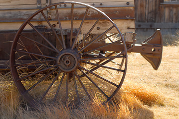 Image showing Old weathered wagon with rusted wheel