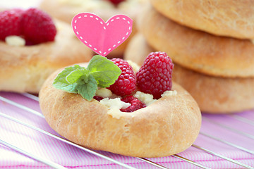 Image showing buns with raspberries