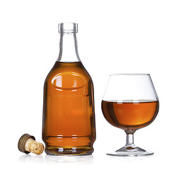 Image showing Cognac brandy bottle and glass isolated on white background