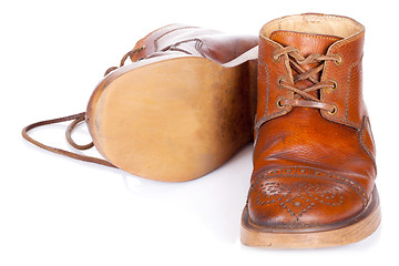 Image showing Red old leather boots isolated on white background