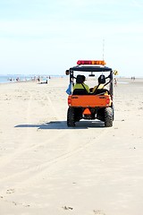 Image showing lifeguards in a car at the beach