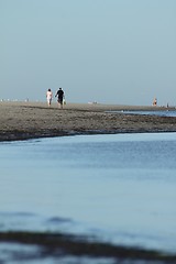 Image showing couple walking at the shoreline