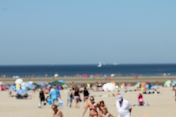 Image showing blur background : people relaxing on the beach