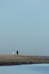 Image showing couple walking at the shoreline