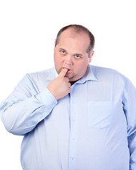 Image showing Fat Man in a Blue Shirt, Thumb-Sucking