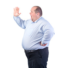 Image showing Fat Man in a Blue Shirt, Shouting