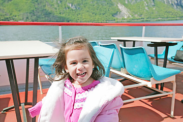 Image showing playful pretty little girl on sail boat in Lugano