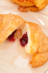 Image showing croissant French brioche filled with berries jam