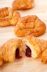 Image showing croissant French brioche filled with berries jam