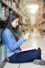 Image showing Hispanic student texting