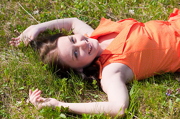 Image showing Pretty girl laying on grass