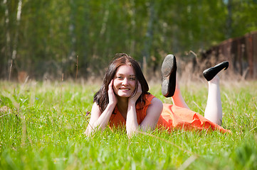 Image showing Pretty girl laying on grass