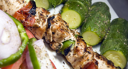 Image showing chicken shish kabob with zucchini  salad Greek style as photogra