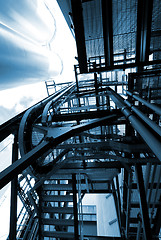 Image showing industrial ladders, cables, pipelines in blue tones