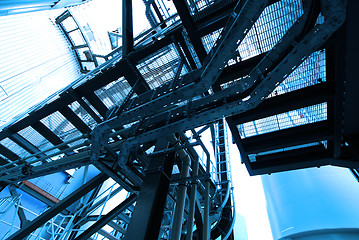 Image showing industrial ladders, cables, pipelines in blue tones