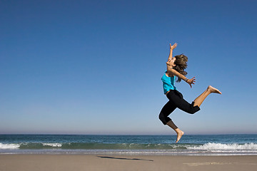 Image showing Jumping on the beach