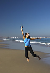 Image showing Jumping on the beach.