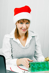 Image showing Attractive girl with a Christmas present
