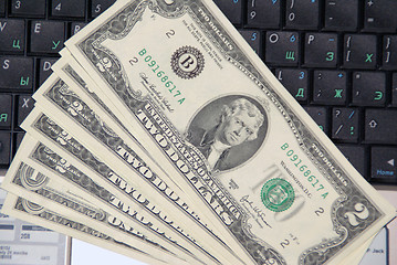 Image showing Dollars on the keyboard of laptop