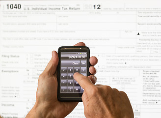 Image showing USA tax form 1040 for year 2012 and calculator