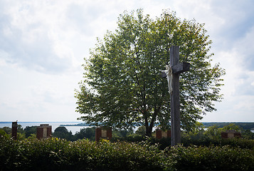 Image showing Statue of Jesus on cross overlooking river
