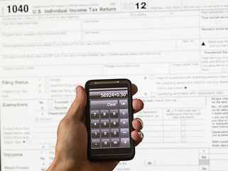 Image showing USA tax form 1040 for year 2012 and calculator